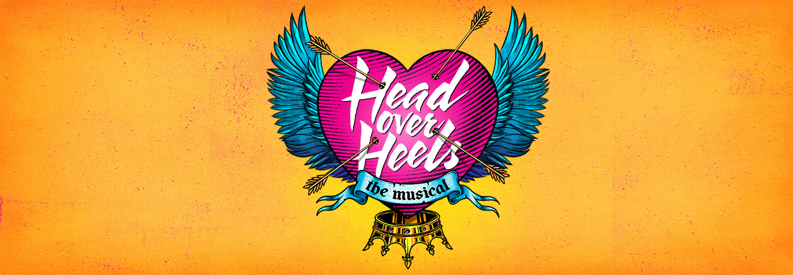 Poster art for Head Over Heels features an illustrated heart with wings, with four arrows sticking from the heart, and an inverted crown beneath the heart. Text on the heart says Head Over Heels. Text in a scroll under the title says The Musical.
